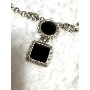 Bright black amulet Necklace Retired